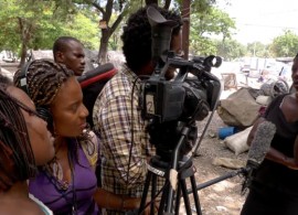 A media team interviews a woman in Haiti. Humanitarian organizations should also involve local media for better management of information and communication of emergency relief efforts. Photo